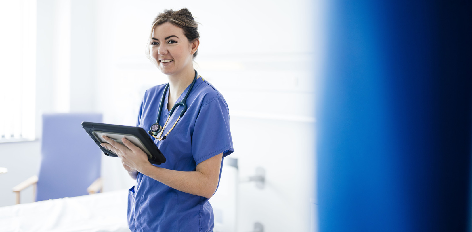 Clinician looking at a mobile phone